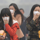 Visibility was reduced to a few dozen meters as commuters used dust masks to filter fine particulate matter from the air.